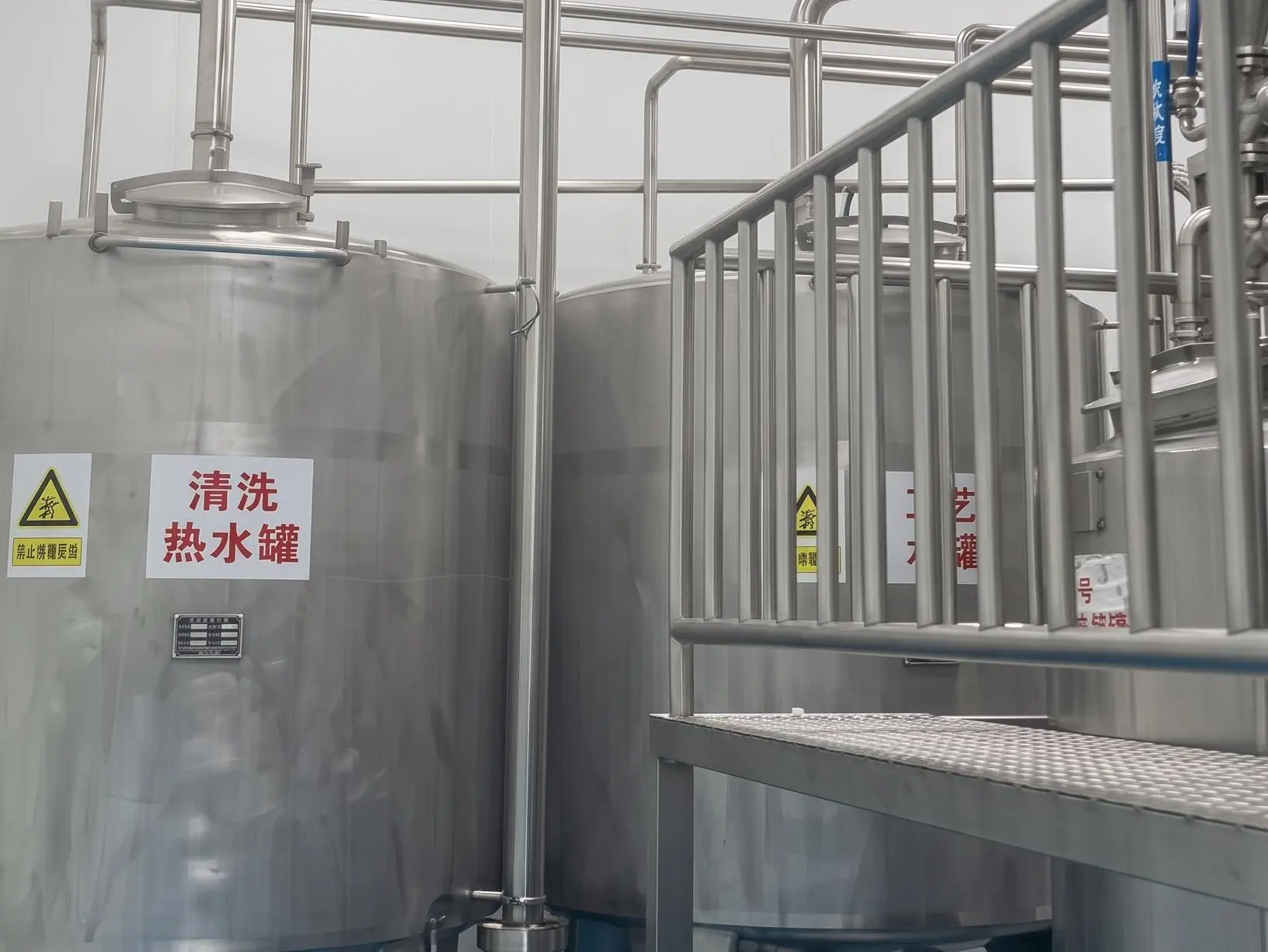 Contract manufacturing beverage ingredients — CIP hot water sanitation tank between every batch